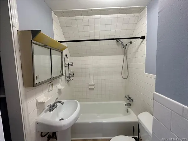 a bathroom with a sink and shower