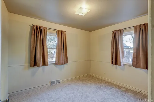 a white toilet sitting next to a bath tub