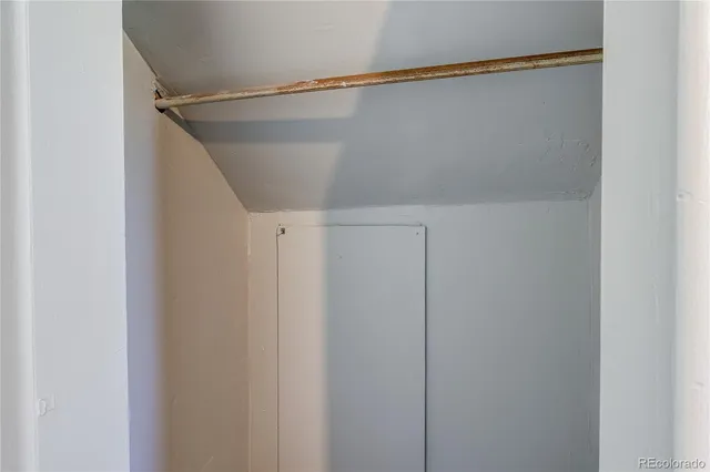 a view of a house with a wooden fence