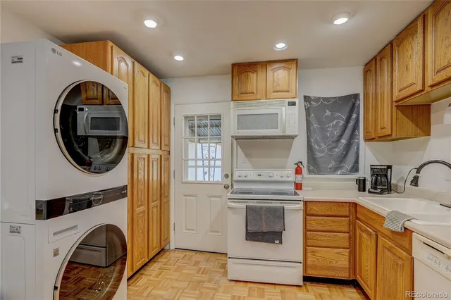 a kitchen with a sink cabinets and appliances