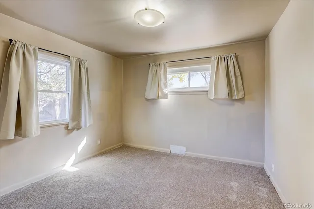 a view of an empty room and window