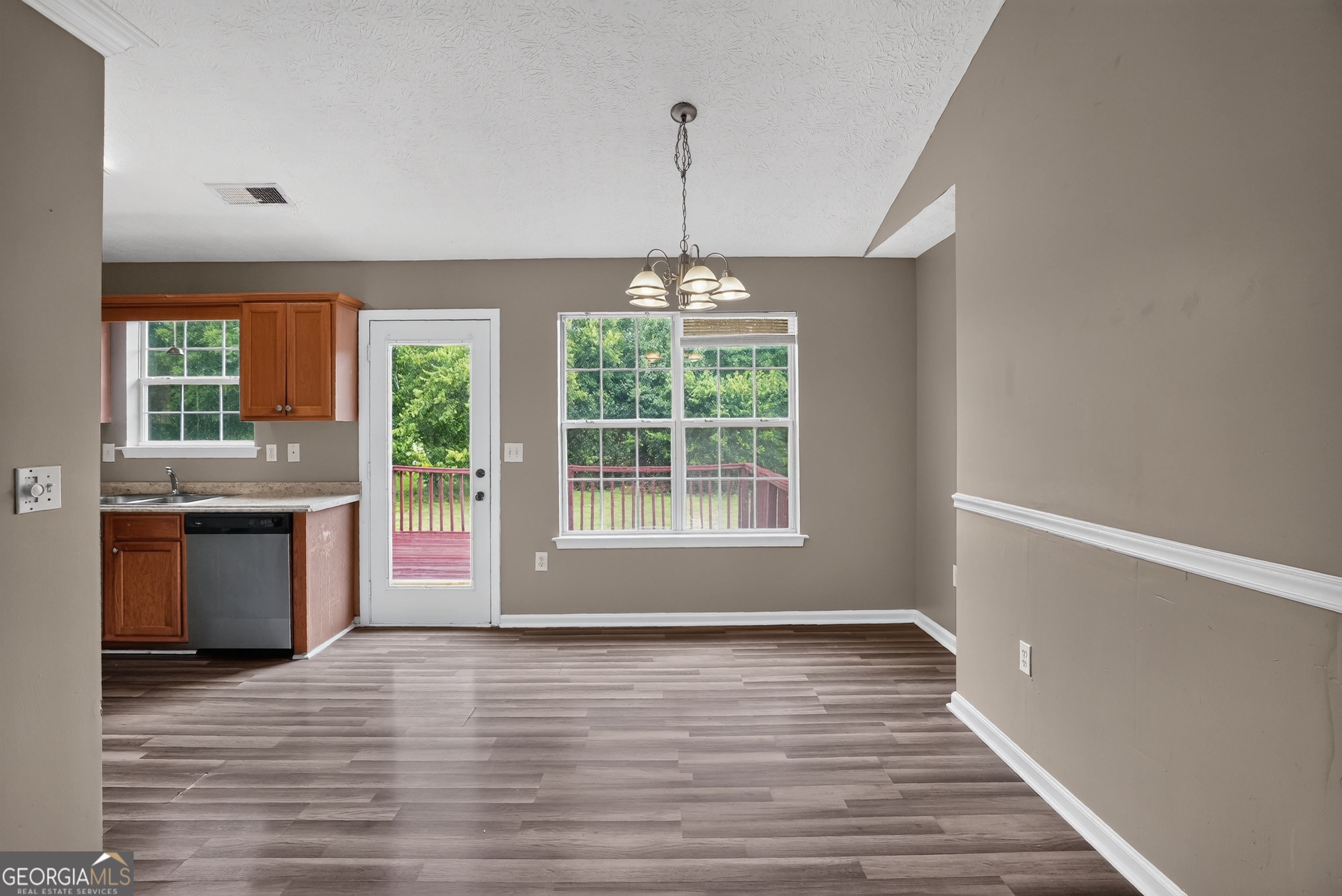 75 Linsley Way Covington, GA 30016 - Photo 29 of 48 a view of a room with window wooden floor and front door