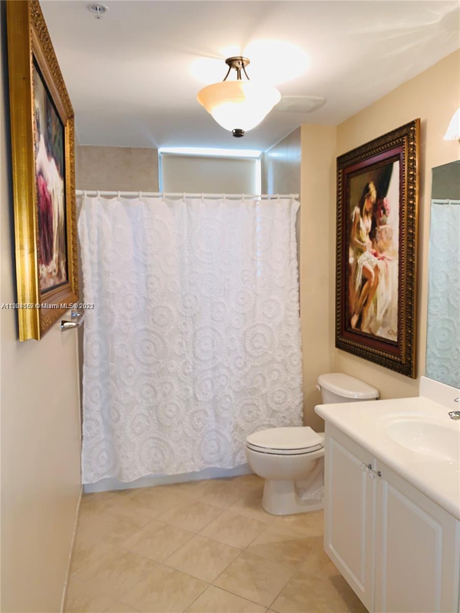 Glenvar Heights Miami, FL 33143 - Photo 18 of 19 a bathroom with a toilet a sink and a shower