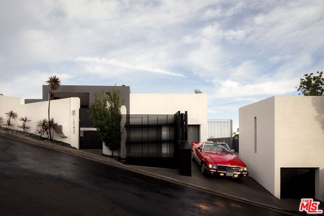 a car parked in front of a house