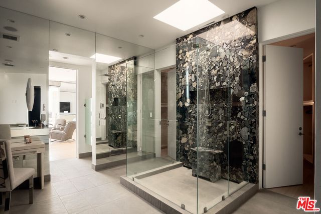a kitchen with granite countertop a sink and a refrigerator