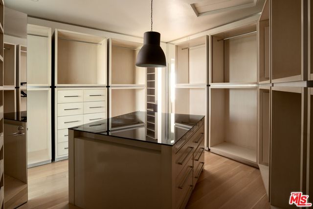 a living room with couch and a large window