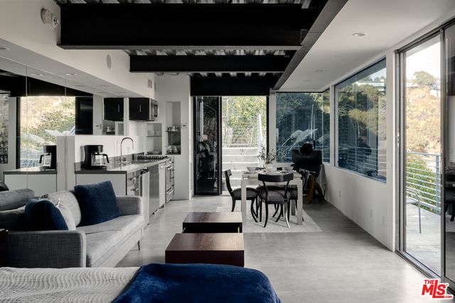 a view of a terrace with a table and chairs