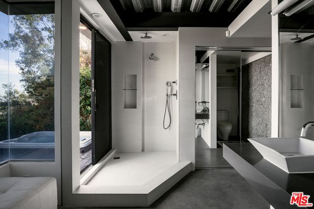 a view of a balcony with chairs