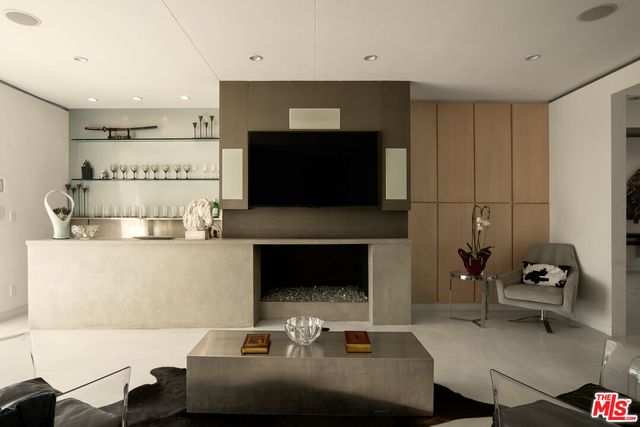 a kitchen with granite countertop a sink stove and cabinets