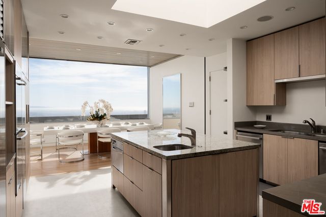 a kitchen with a sink stove and refrigerator