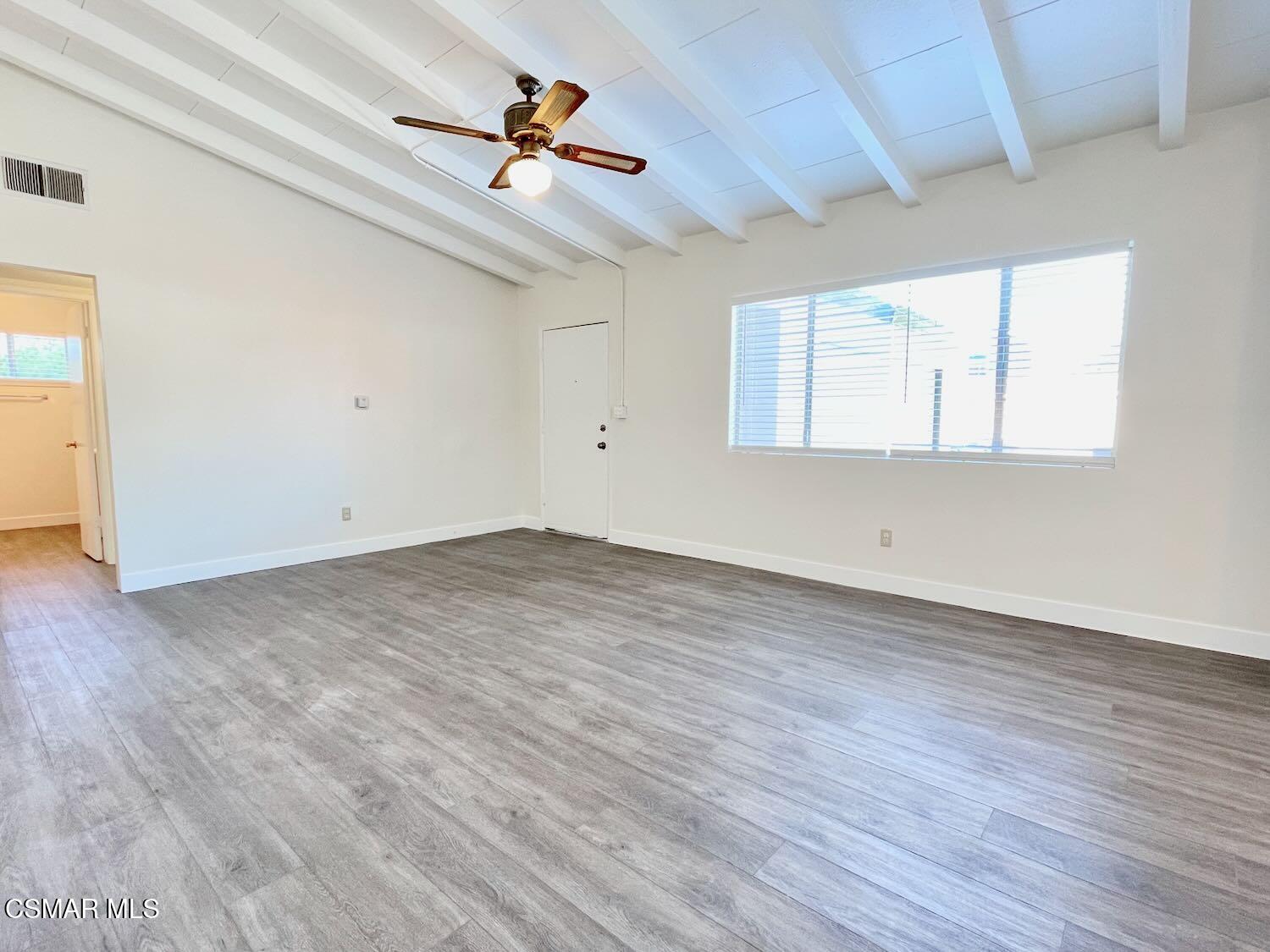 4120 Hi Drive Simi Valley, CA 93063 - Photo 5 of 29 an empty room with wooden floor chandelier fan and windows