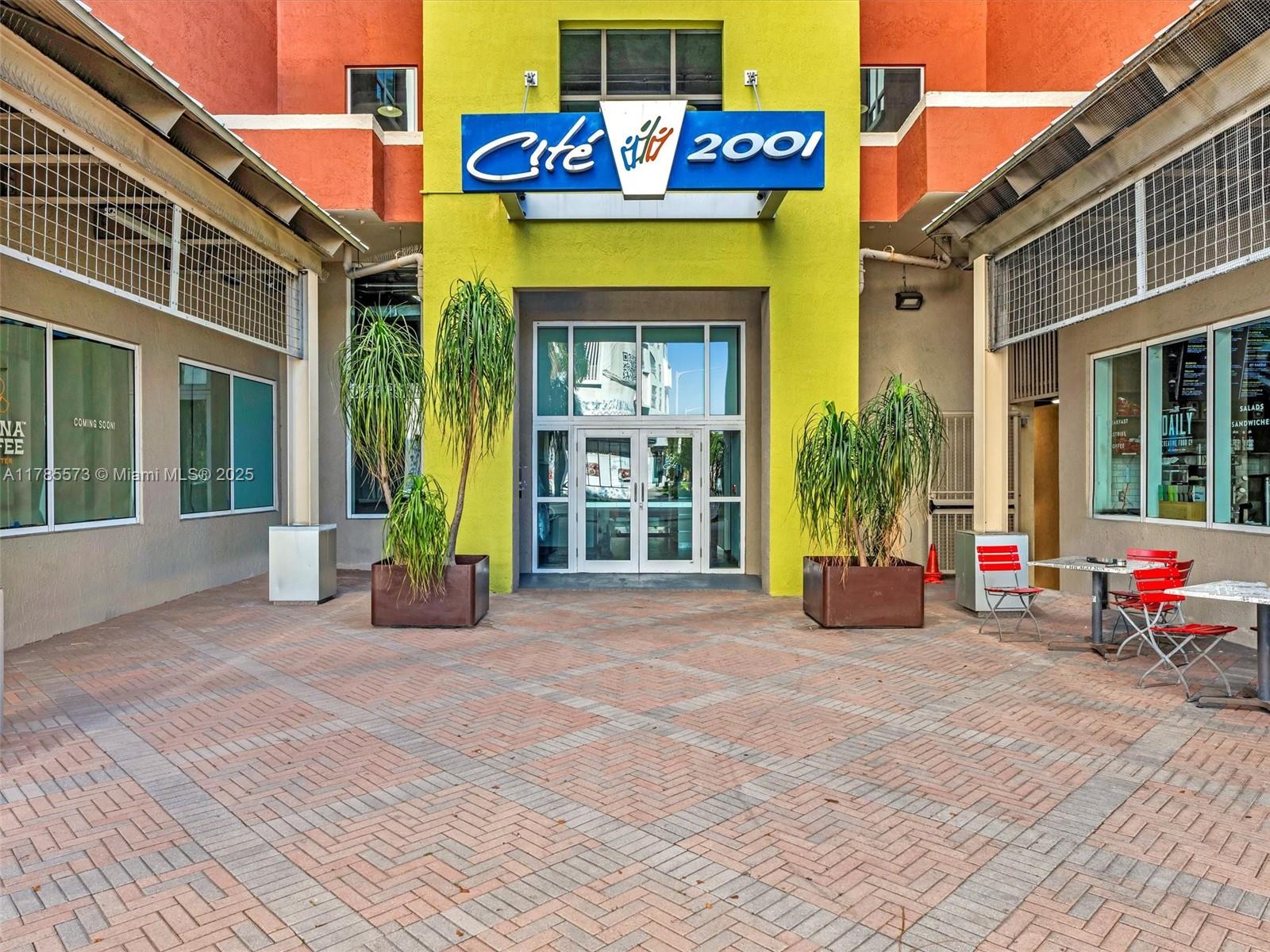 a view of a building with glass windows and door