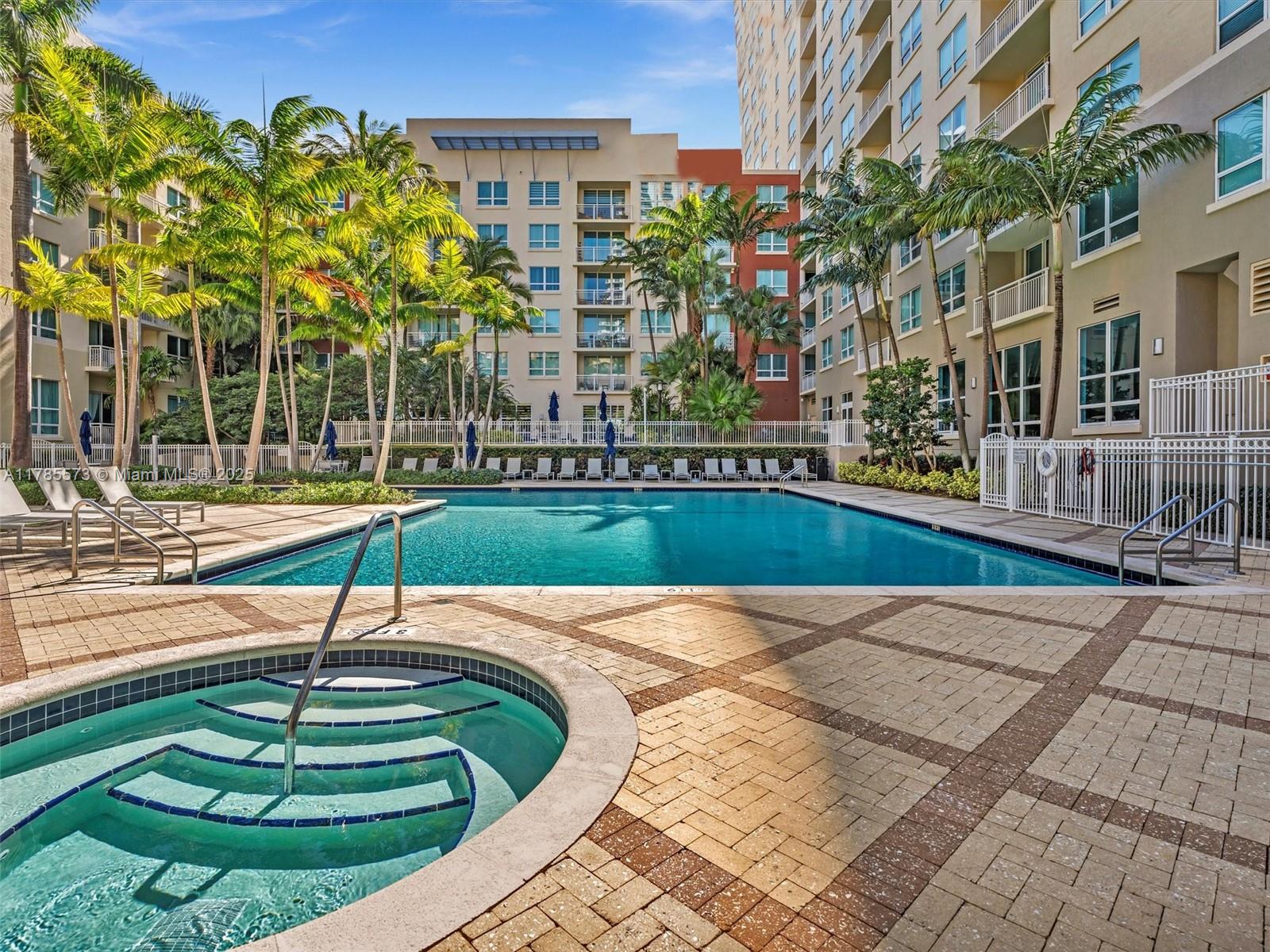 2001 Biscayne Boulevard, Unit 3413 Miami, FL 33137 - Photo 11 of 15 a swimming pool with outdoor seating and yard
