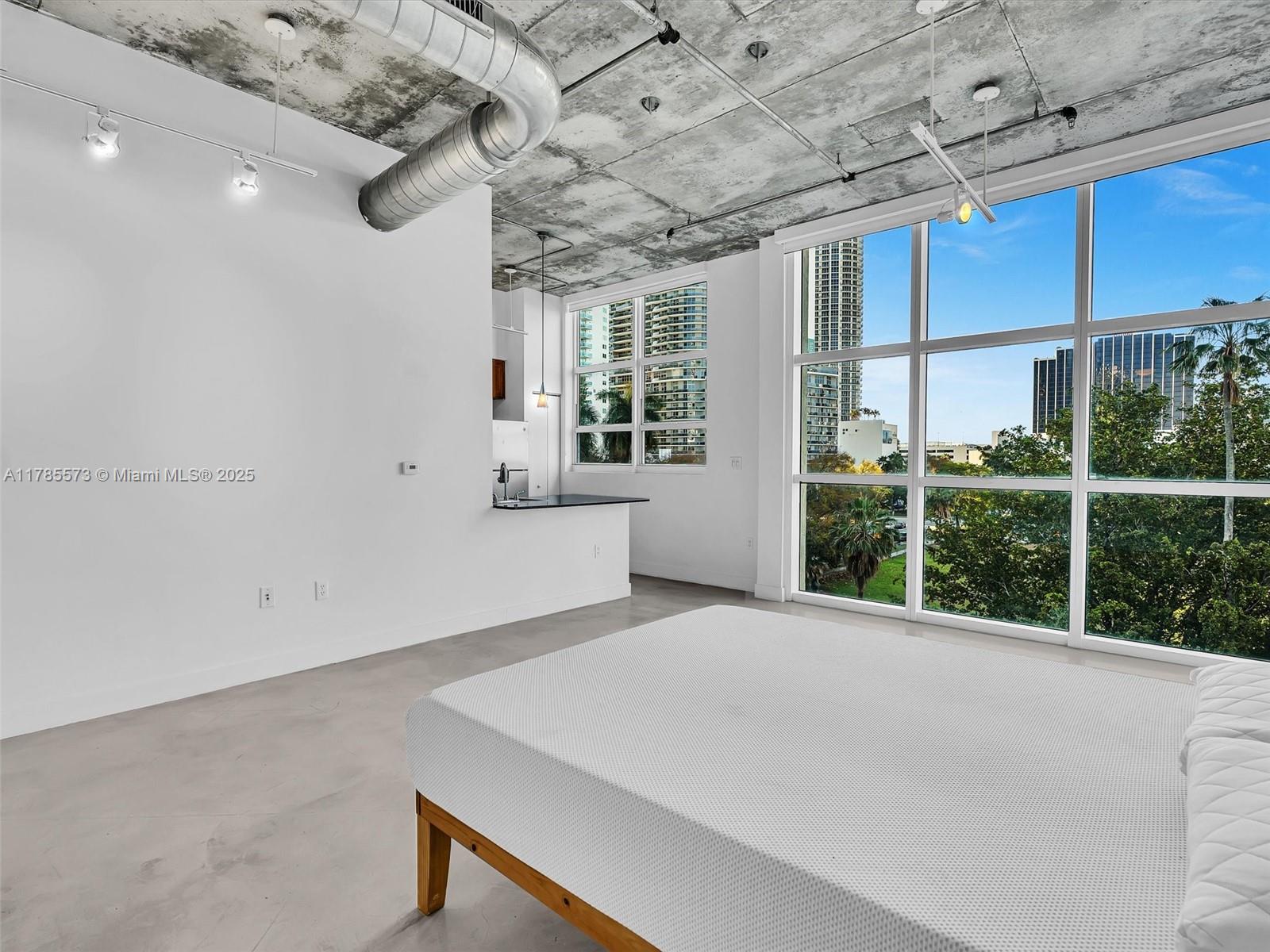 2001 Biscayne Boulevard, Unit 3413 Miami, FL 33137 - Photo 6 of 15 a view of an empty room with a window