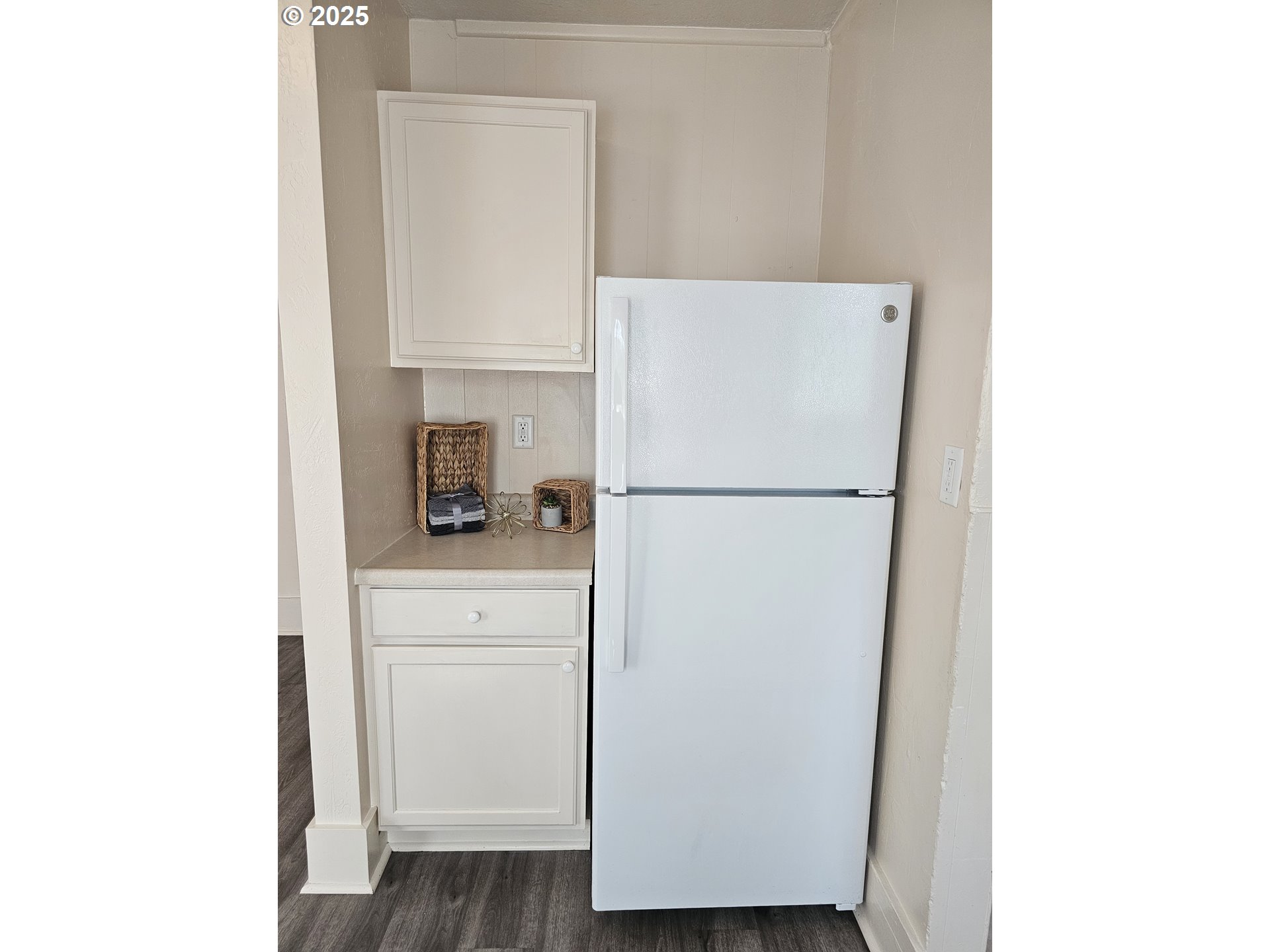 1760 West Broadway Eugene, OR 97402 - Photo 16 of 40 a kitchen with a refrigerator and cabinets