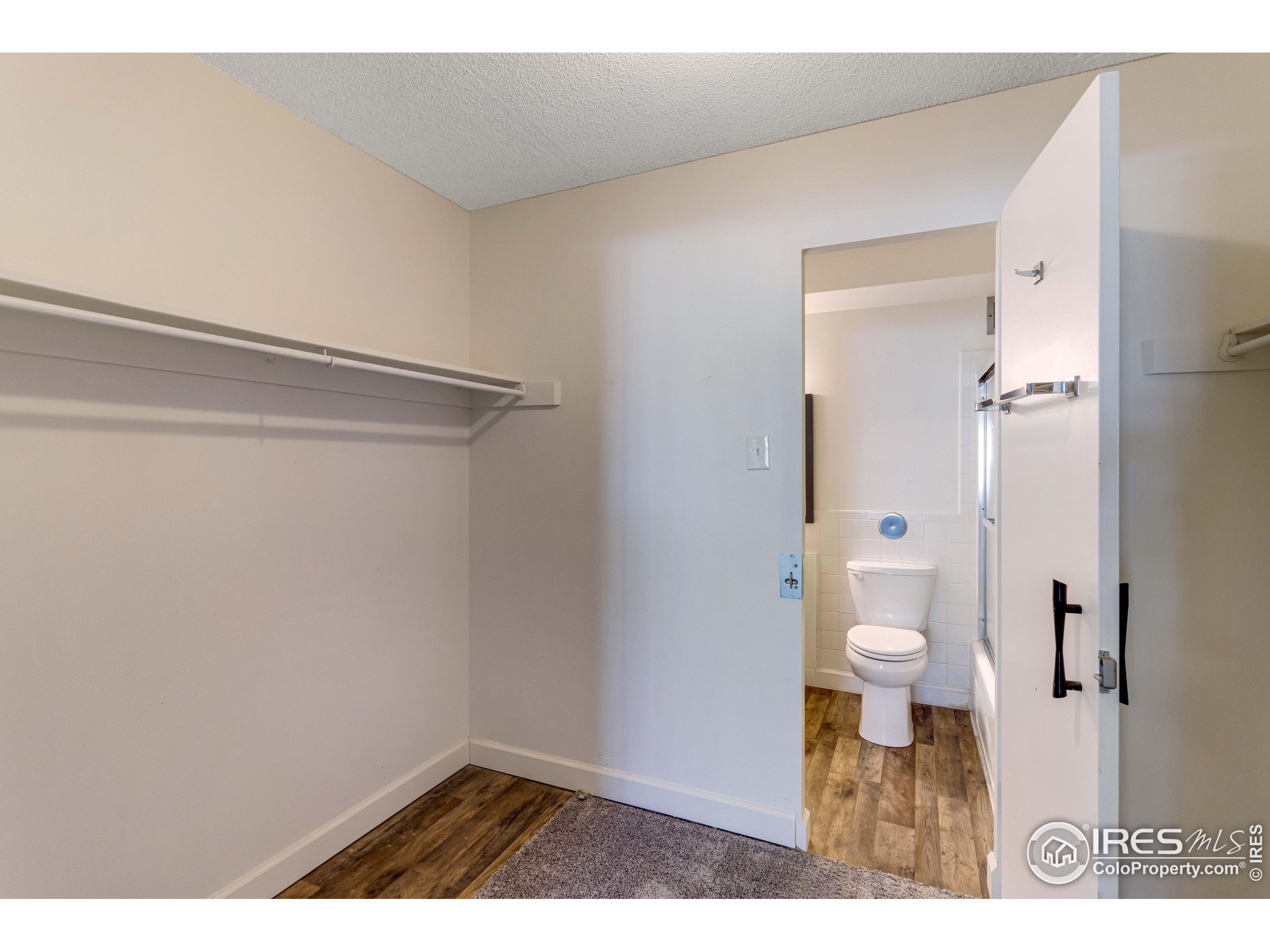 735 South Alton Way Denver, CO 80247 - Photo 12 of 29 a bathroom with a toilet and a shower