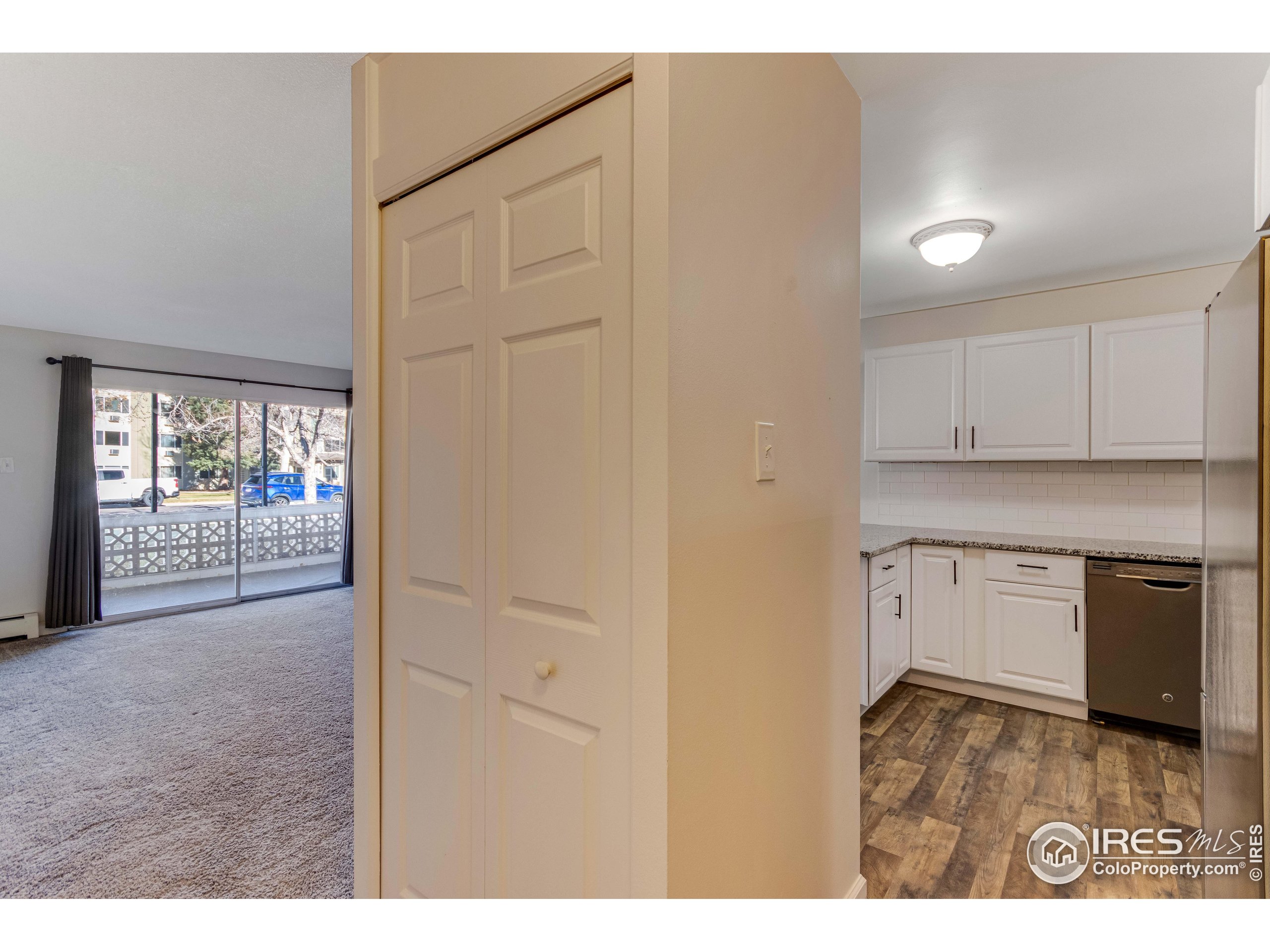 735 South Alton Way Denver, CO 80247 - Photo 19 of 29 a kitchen with white cabinets and a stove