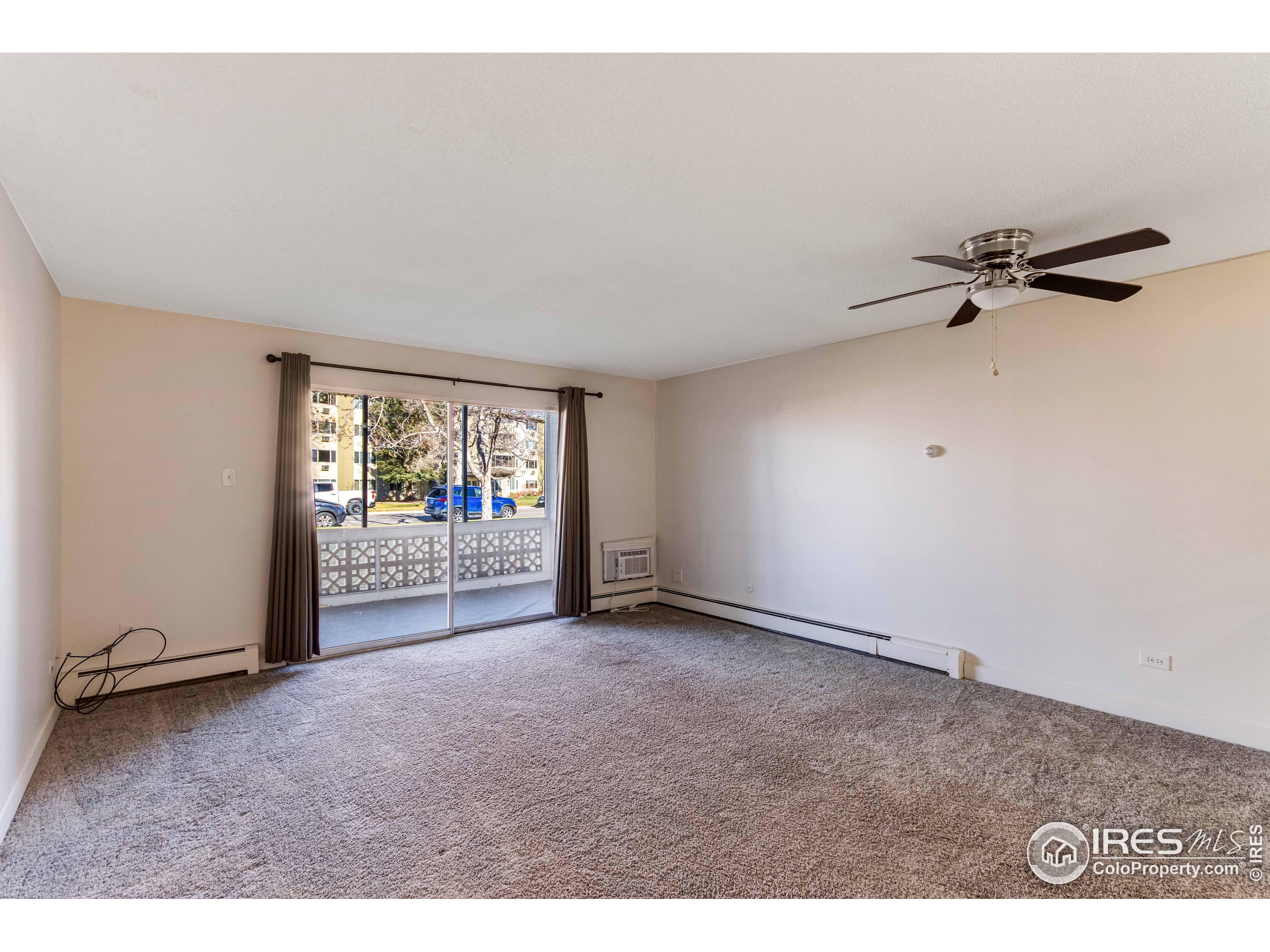 735 South Alton Way Denver, CO 80247 - Photo 21 of 29 a view of an empty room and a window