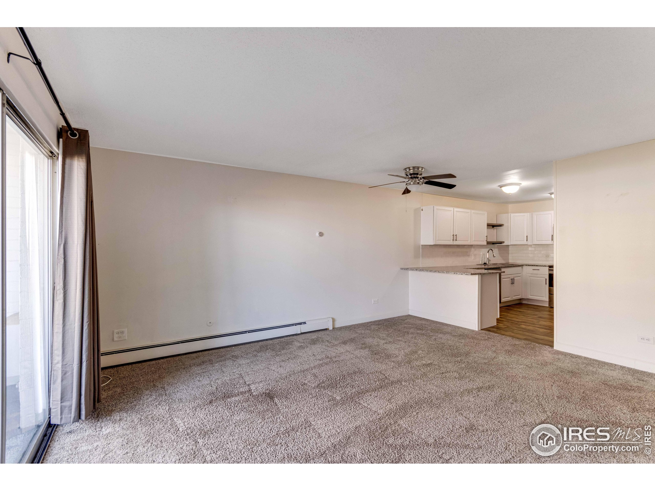 735 South Alton Way Denver, CO 80247 - Photo 22 of 29 a view of a kitchen with a sink and cabinets