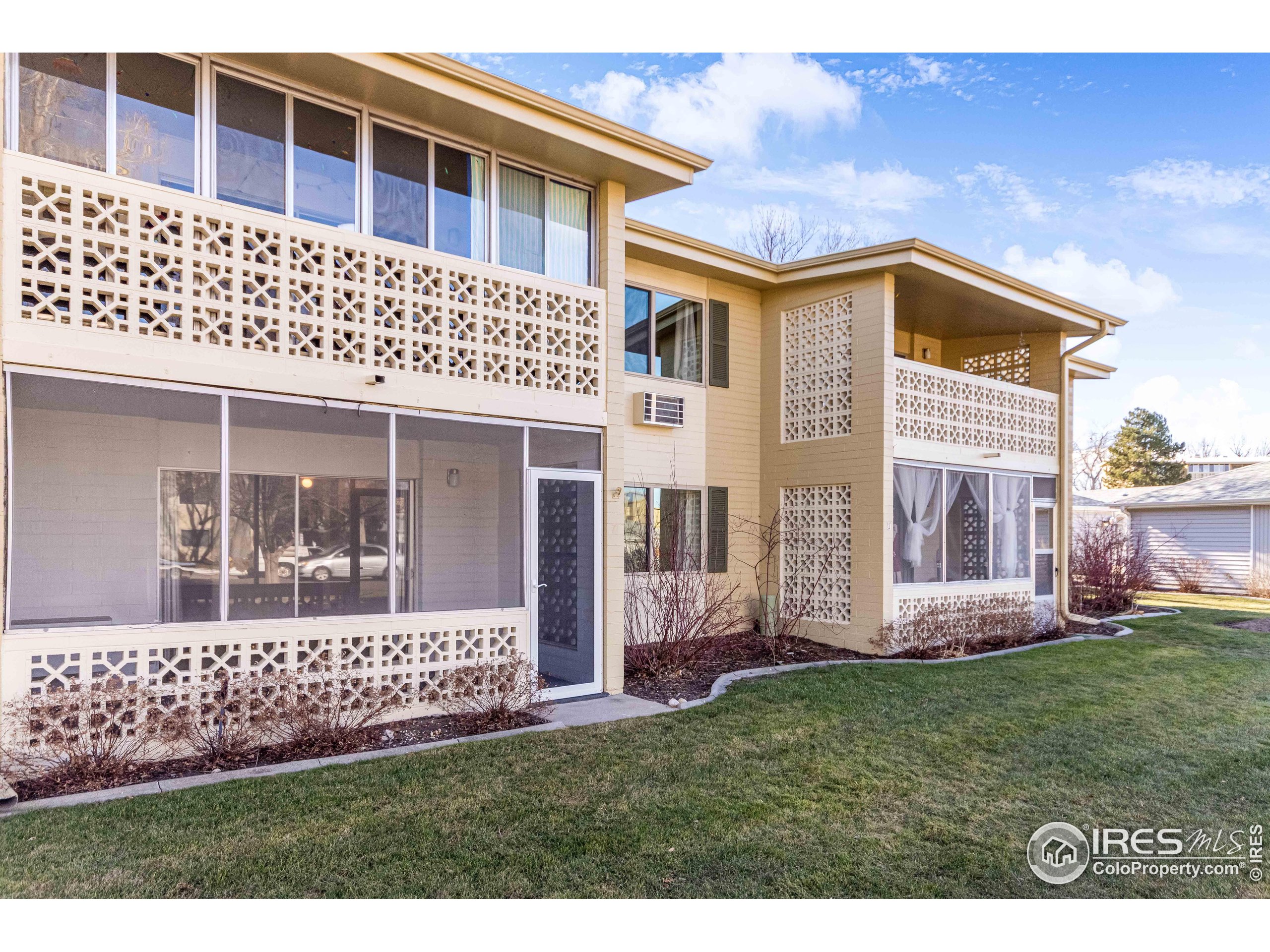 735 South Alton Way Denver, CO 80247 - Photo 27 of 29 a front view of a house with a yard