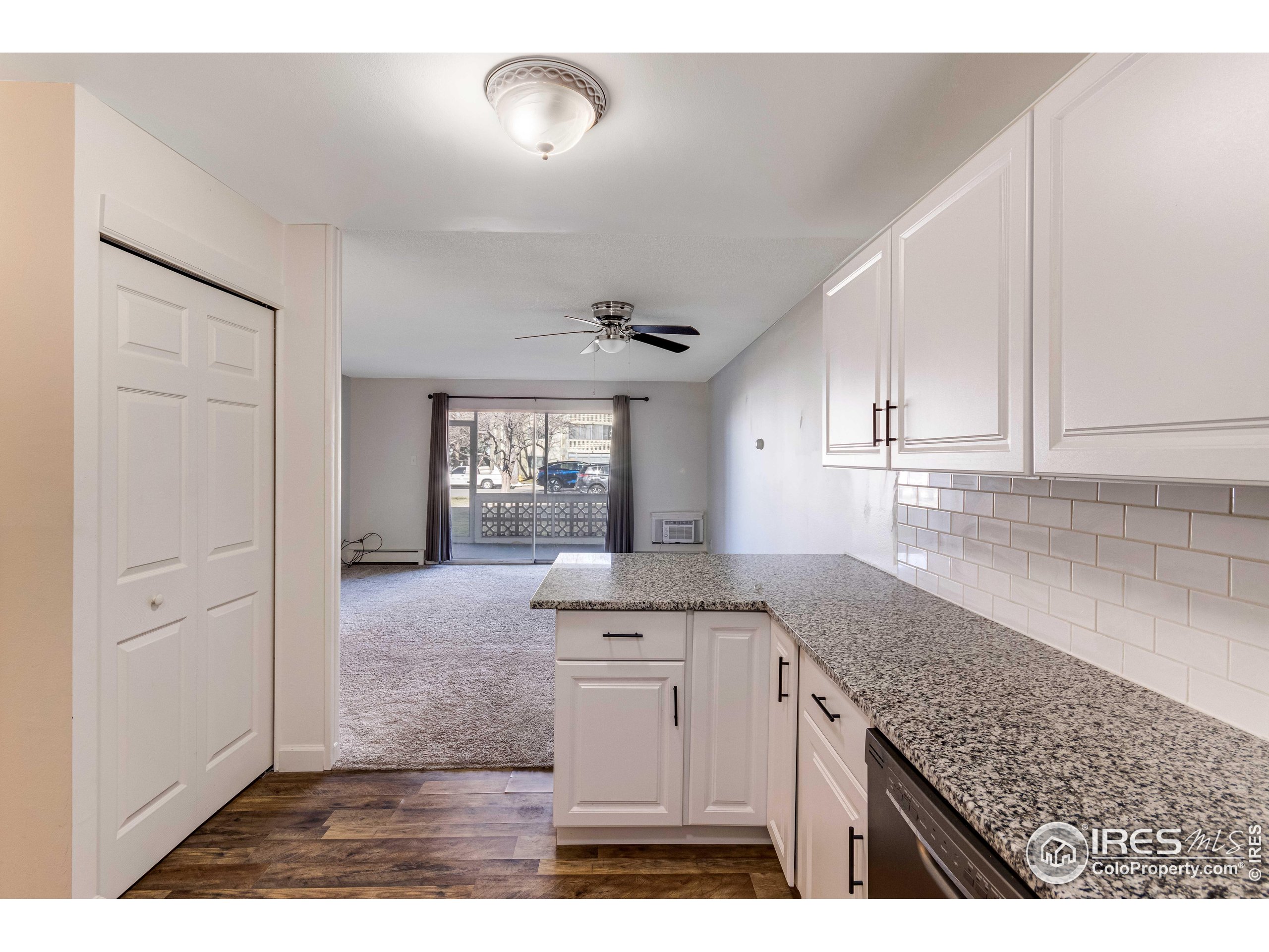 735 South Alton Way Denver, CO 80247 - Photo 9 of 29 a kitchen with granite countertop a sink stainless steel appliances and cabinets