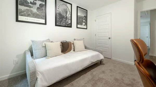 a bedroom with a bed and furniture