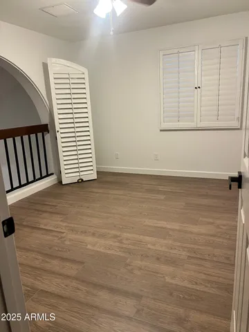 an empty room with wooden floor