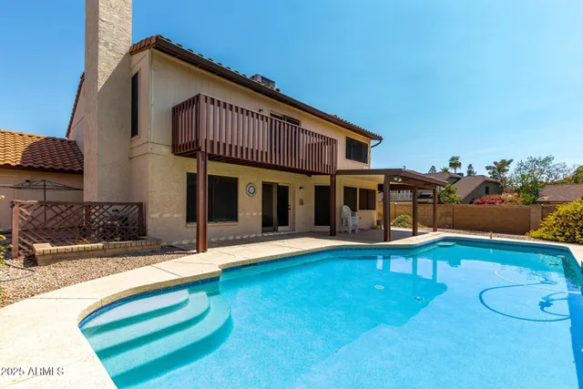 a front view of a house with swimming pool