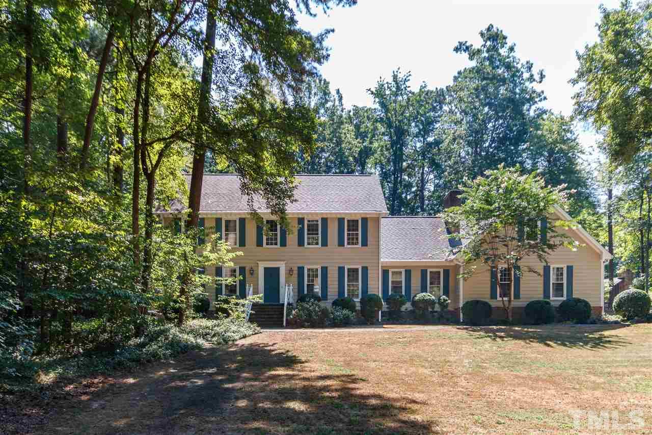 4921 Springwood Drive Raleigh, NC 27613 - Photo 1 of 25 a front view of a house with a yard