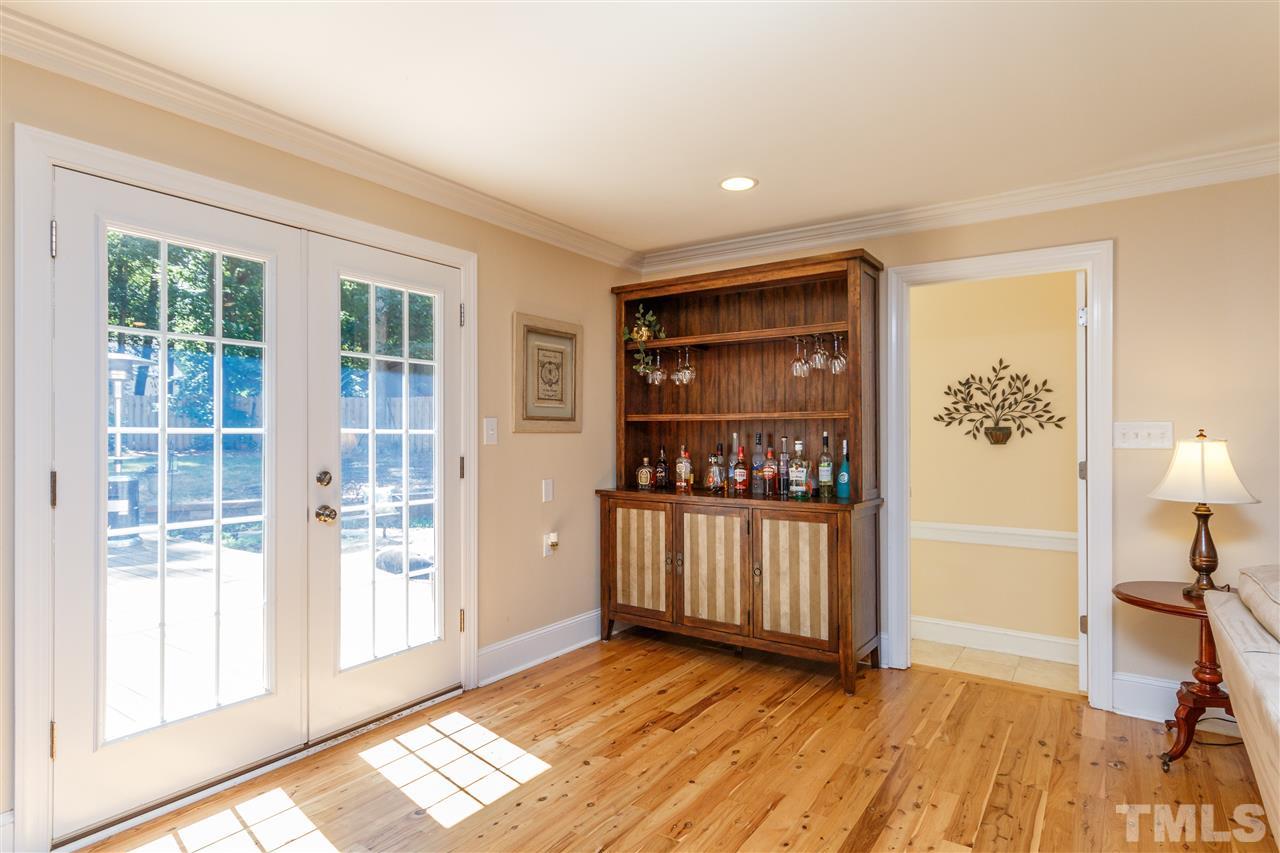 4921 Springwood Drive Raleigh, NC 27613 - Photo 7 of 25 a view of front door with wooden floor