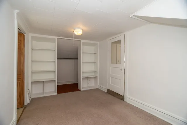 a view of an empty walk in closet