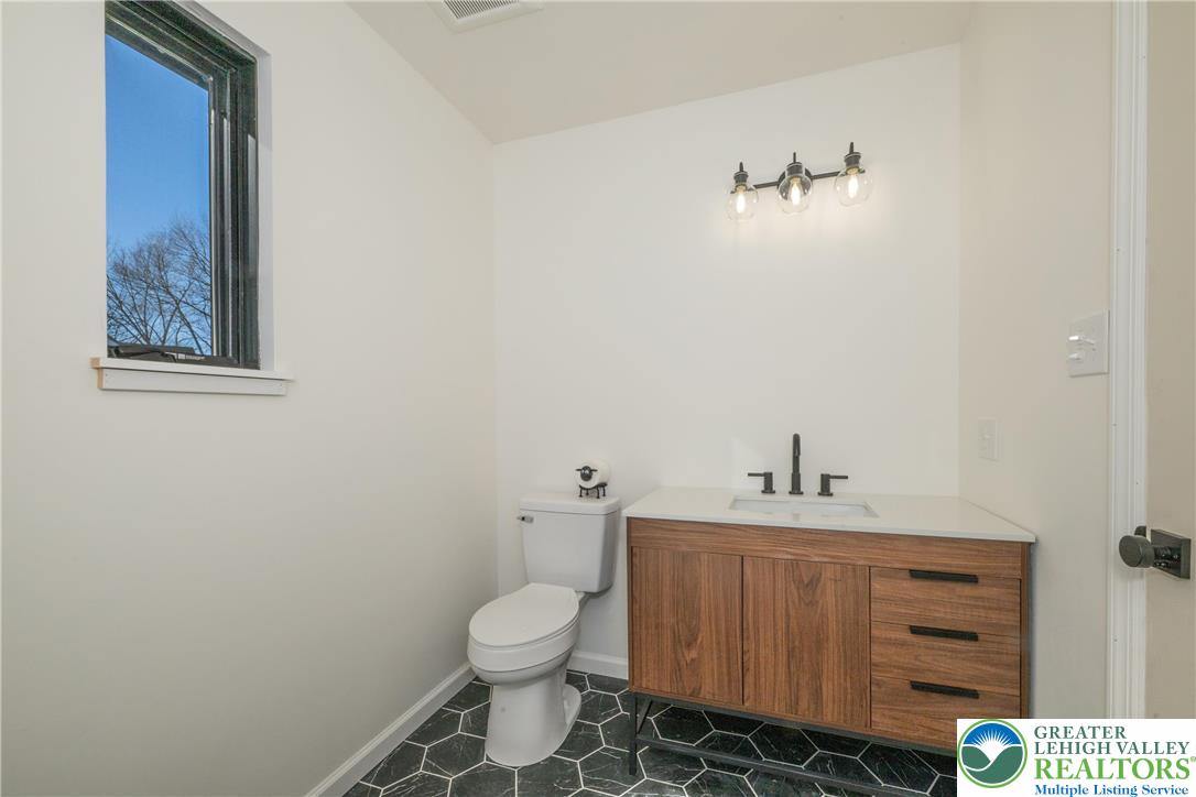 111 Main Street Glendon, PA 18042 - Photo 24 of 33 a bathroom with a toilet sink and vanity