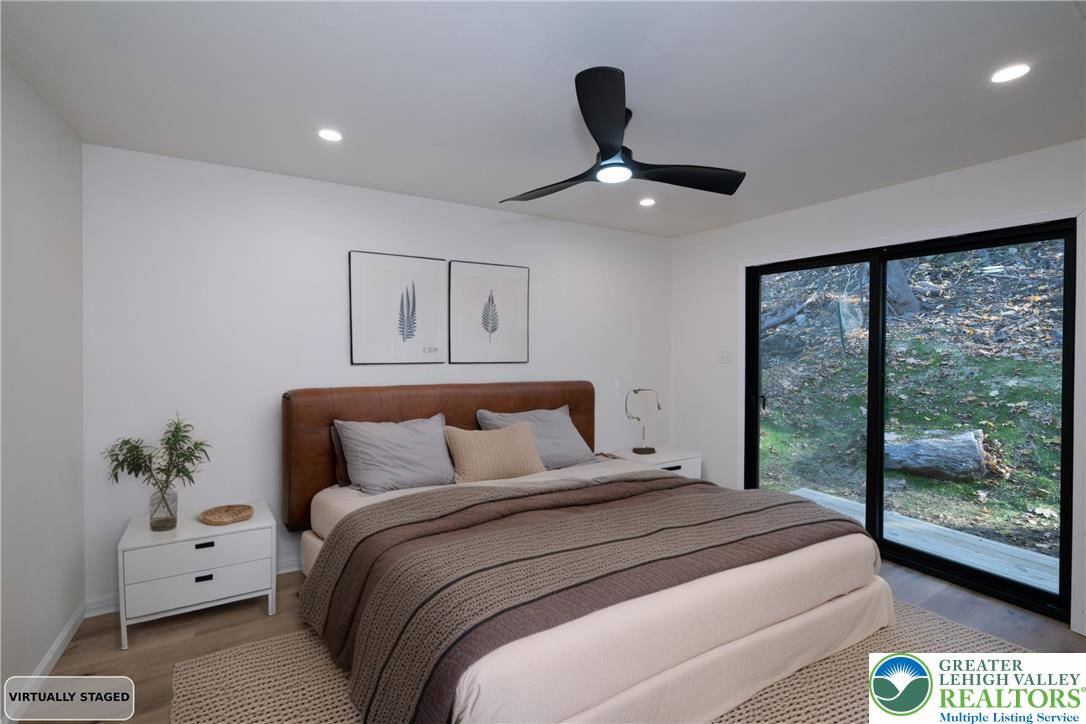 111 Main Street Glendon, PA 18042 - Photo 10 of 33 a bedroom with a bed and a large window