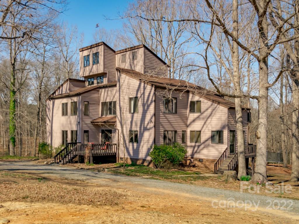 2214 Wishbone Road Monroe, NC 28112 - Photo 1 of 44 a view of a white house with a large tree in front of it