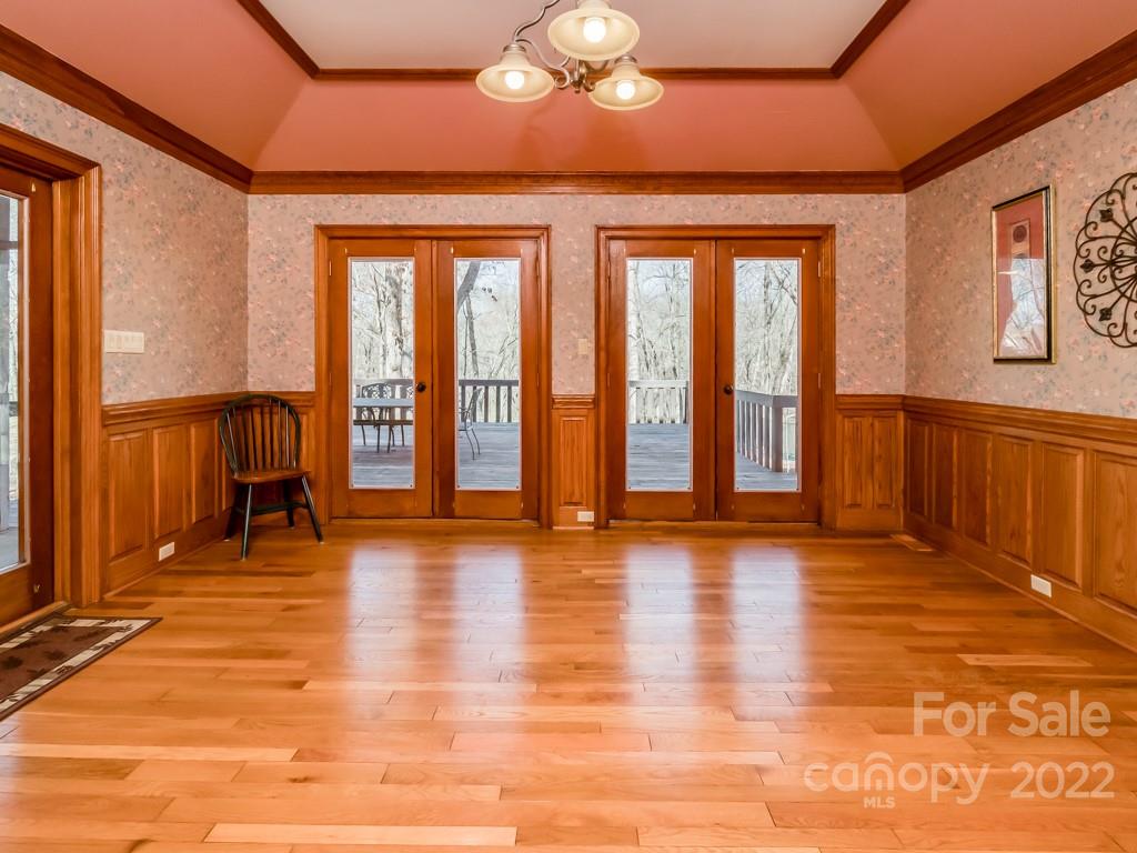 2214 Wishbone Road Monroe, NC 28112 - Photo 12 of 44 a view of an empty room with wooden floor and a window
