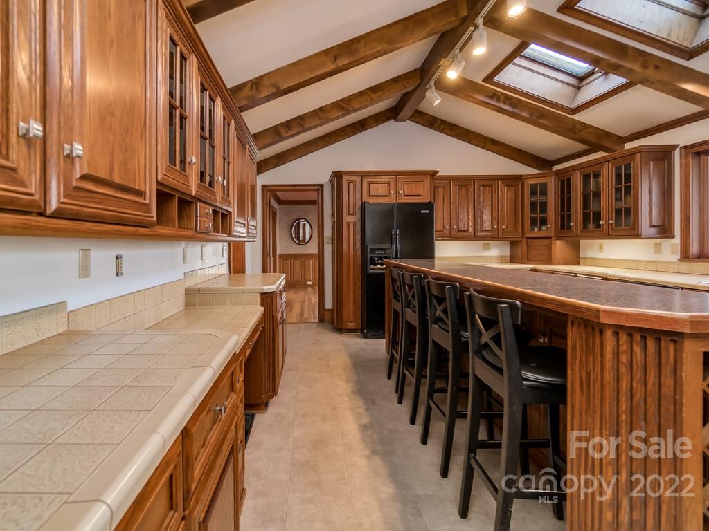 2214 Wishbone Road Monroe, NC 28112 - Photo 16 of 44 a kitchen with stainless steel appliances granite countertop a sink and cabinets