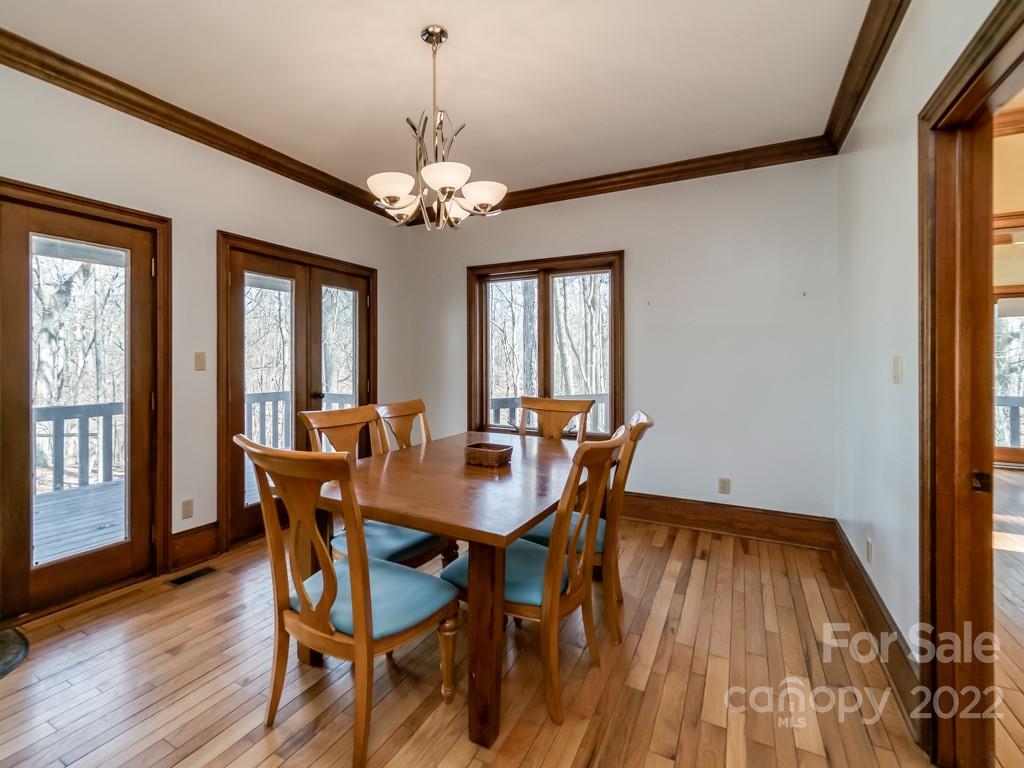 2214 Wishbone Road Monroe, NC 28112 - Photo 17 of 44 a view of a dining room with furniture window and wooden floor