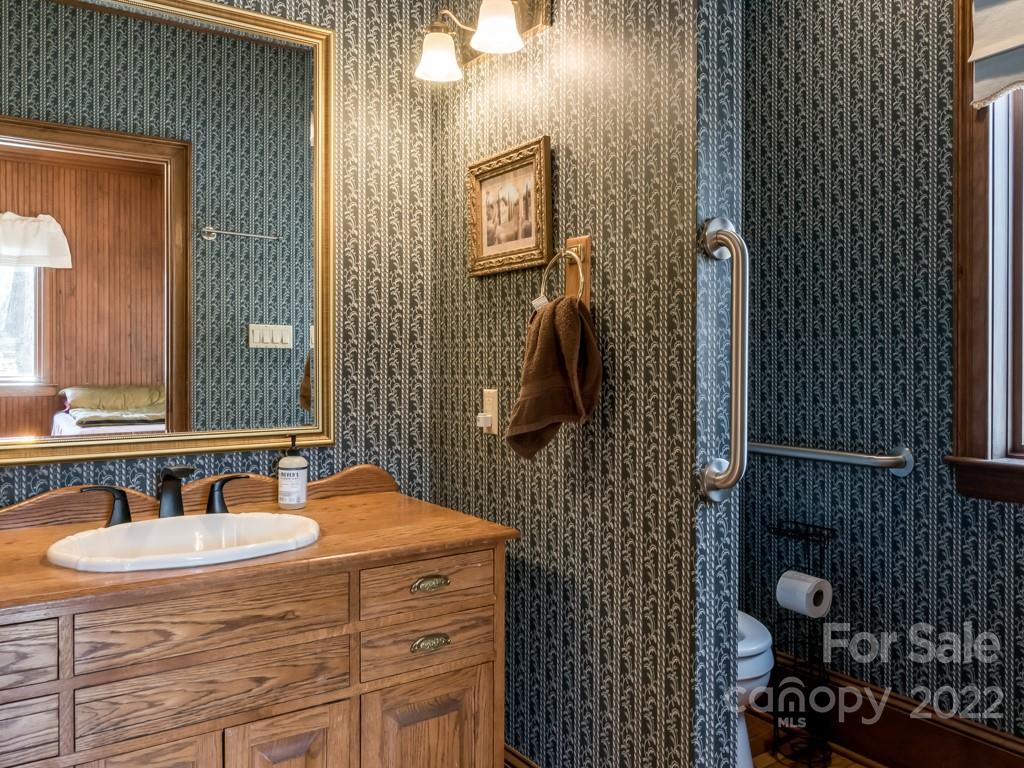 2214 Wishbone Road Monroe, NC 28112 - Photo 24 of 44 a bathroom with a sink and mirror