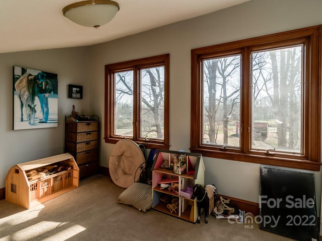2214 Wishbone Road Monroe, NC 28112 - Photo 38 of 44 a living room with furniture and a floor to ceiling window
