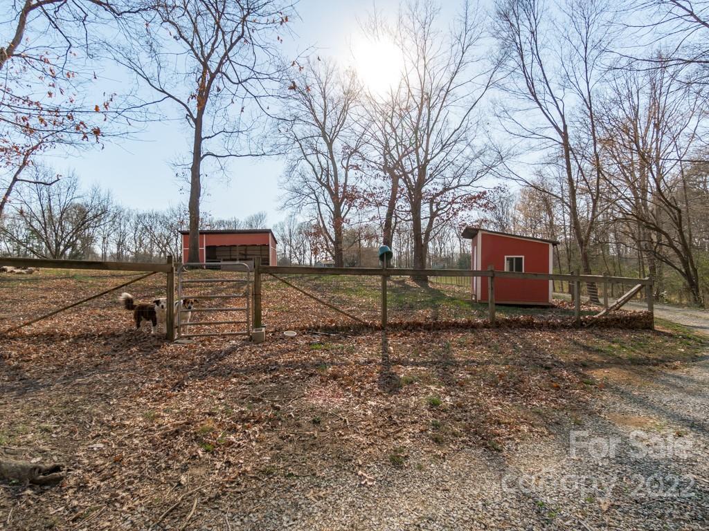 2214 Wishbone Road Monroe, NC 28112 - Photo 4 of 44 a backyard of a house with table and chairs