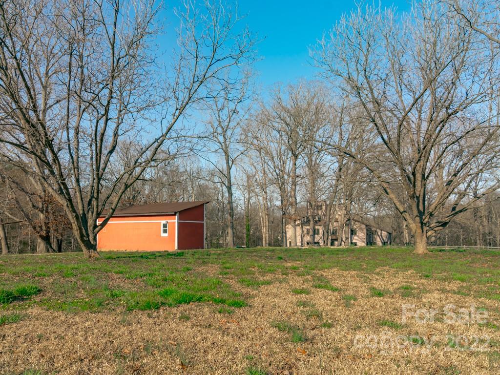 2214 Wishbone Road Monroe, NC 28112 - Photo 5 of 44 a view of a backyard with large trees