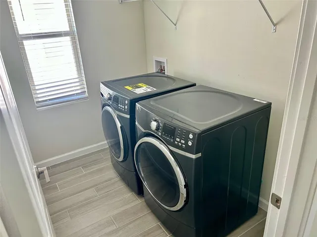 a utility room with dryer and washer