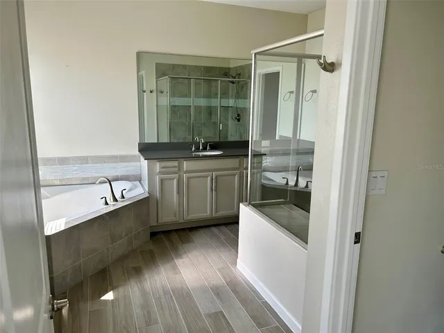 a kitchen with granite countertop a sink and cabinets