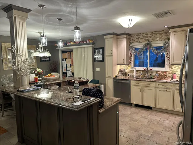a kitchen with a sink stove and cabinets