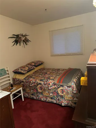 a room with wooden floor and window