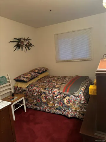 a room with wooden floor and window