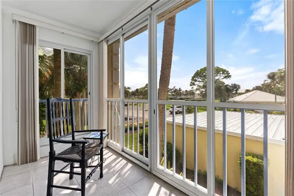 a view of a balcony with chairs