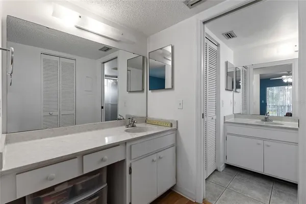 a bathroom with a sink a mirror and a bathtub