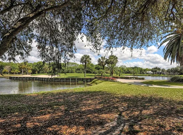 a view of a lake with houses in the back