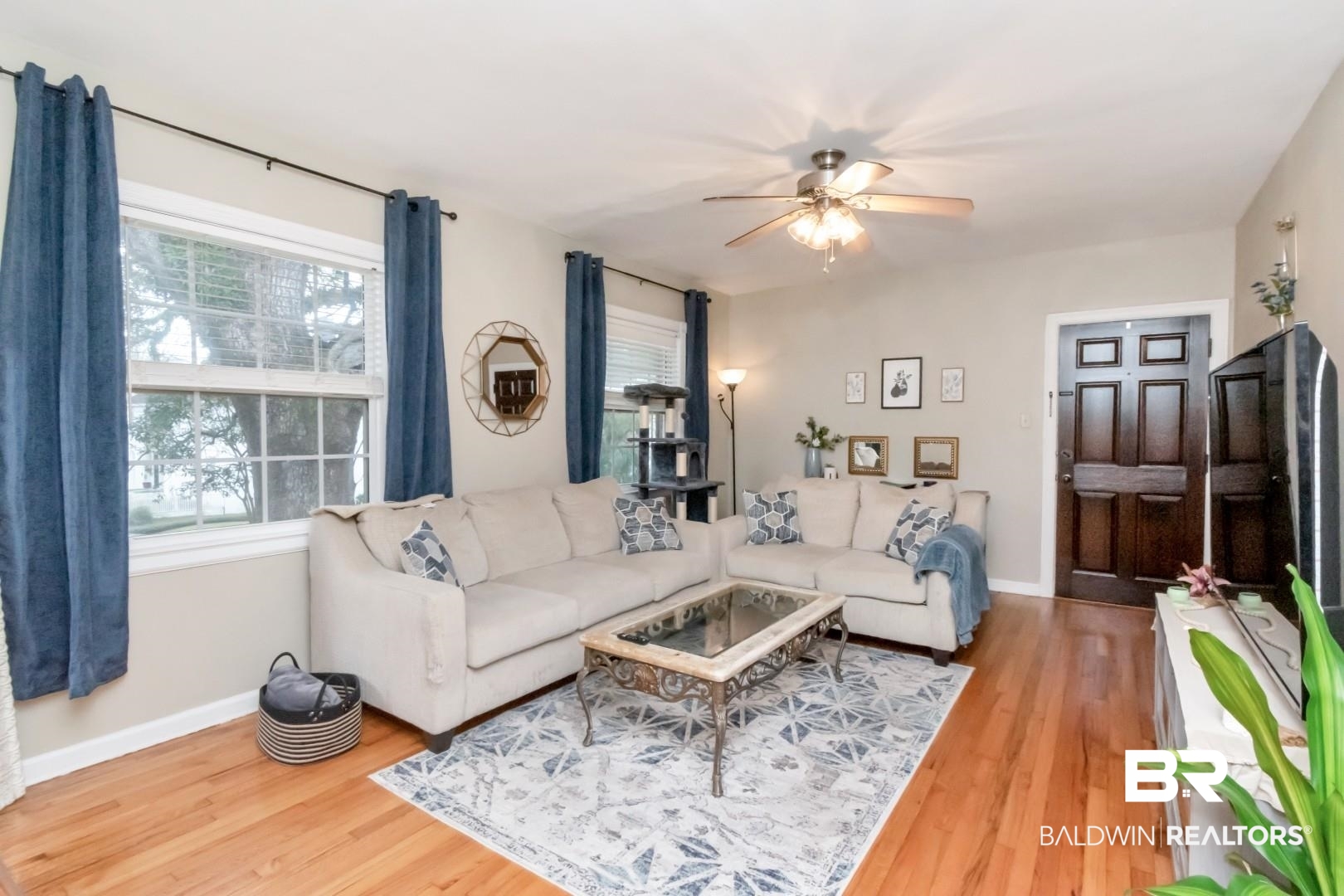 214 Upham Street, Unit 17C Mobile, AL 36607 - Photo 15 of 32 Living area with light wood finished floors and ceiling fan
